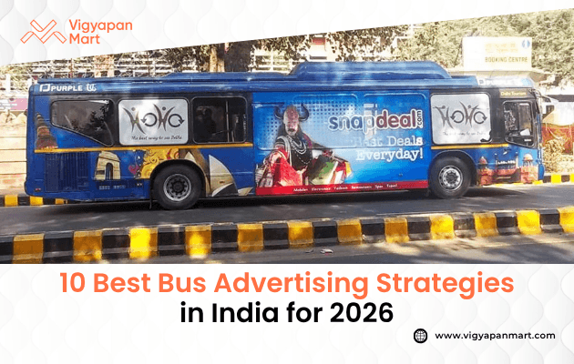 Blue bus with vibrant Snapdeal and NID painting ads, parked near a tree-lined road. Text: "10 Best Bus Advertising Strategies in India for 2026" at the bottom.