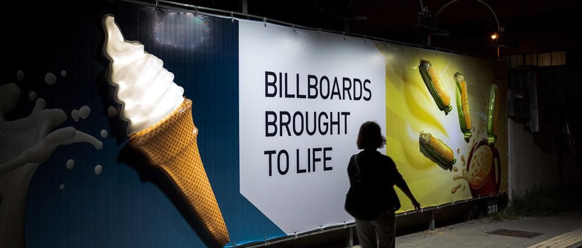 Street Furniture Advertising campaign with branded bus shelters, benches, and digital displays in a high-footfall city area
